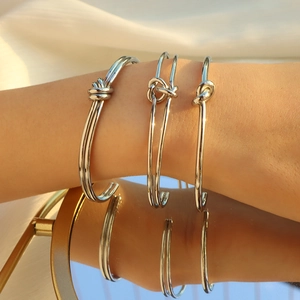 Bracciale rigido geometrico vintage in acciaio inossidabile lucido con nodo argento