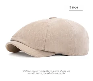 Detailed close-up of beige herringbone fabric on a vintage newsboy cap for men