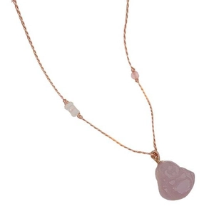 Pink chalcedony Buddha pendant on a woven cord necklace with matching decorative beads