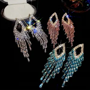 Sparkling silver needle tassel earrings with geometric crystals in silver, pink, and blue