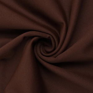 Macro detail of dark brown dress fabric showing soft texture and smooth drape