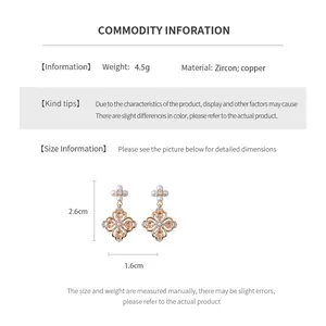 Detailed view of cubic zirconia flower earrings featuring refined copper base and pearls