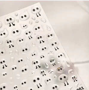 Macro shot of 3D embossed cute white ghost nail art stickers with glossy jelly finish