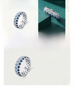 Detailed view of S925 sterling silver wide band ring featuring blue and white crystals