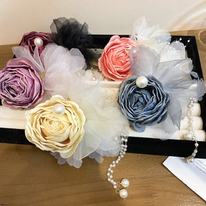 Elegant lace rose hair clip with faux pearl tassels and layered mesh fabric petals