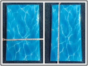 Detailed view of blue ocean wave table decor showing product dimensions with tape measure