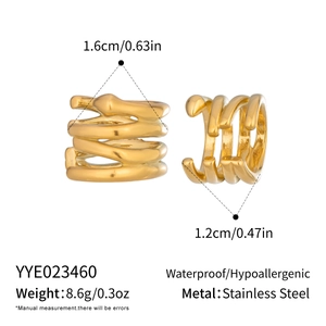 Detail of waterproof gold irregular spiral ear cuffs made of hypoallergenic stainless steel