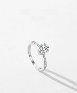 Close-up of a sparkling S925 silver crown ring with six-prong set round zircon and side stones