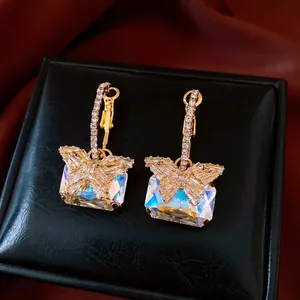 Luxury butterfly drop earrings with aurora crystals and gold finish on black leather box