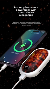 Close-up of portable hand warmer power bank with digital display and lava texture