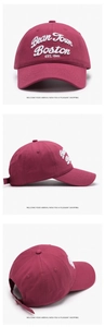 Detail view of burgundy baseball cap featuring 3D white Bean Town Boston embroidery