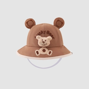 Detail of baby bear bucket hat showing 3D ears and Lucky Bear embroidery texture