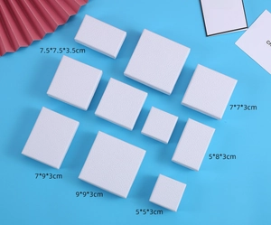 White minimalist jewelry boxes showing dimensions of 5x5x3cm to 9x9x3cm on blue background