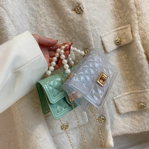 Quilted jelly crossbody bag with pearl handle and golden chain strap in soft colors