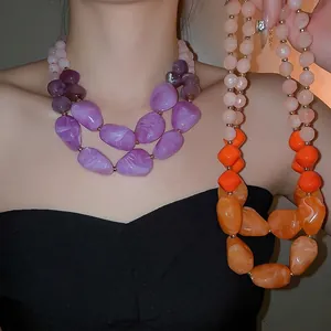 Double-layered acrylic chunky beaded necklace with marble texture and golden spacers