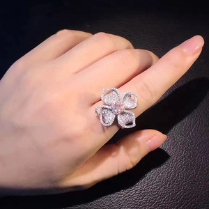 Luxury floral cocktail ring with pink gemstone center and full pavé zircon on hand