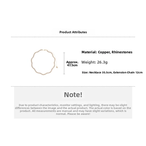 Detailed view of wave pendant necklace with copper and rhinestone material specifications