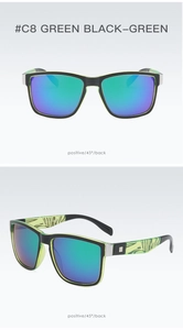 Detail view showing black sports sunglasses with green herbal patterns and mirror lenses