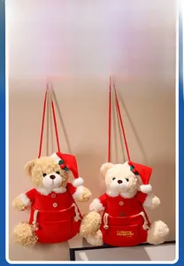 Detail of Christmas teddy bear plush storage pouch with festive embroidery and red lanyard