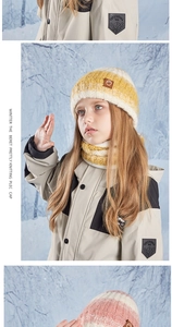Close-up of kids winter knit beanie and scarf set featuring leather patch detail
