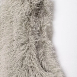 Elegant gray faux fur vest with a round neck, featuring a soft and dense plush texture