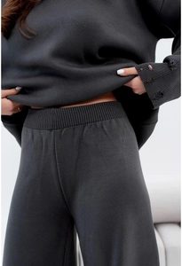 Close-up of dark grey knit texture and ribbed waistband of the two-piece set