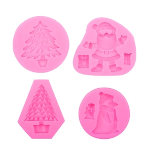 Pink silicone mold set featuring Santa Claus, Christmas trees, and penguin for DIY crafts
