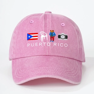 Close-up of pink Puerto Rico baseball cap featuring a washed denim texture and embroidery