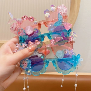 Kids Elsa Princess sunglasses with glitter frames, decorative pearls, and seashell details