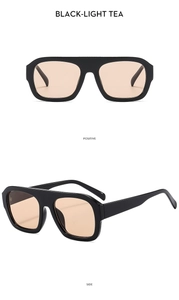 Detail view of stylish thick black frame sunglasses with light tea lenses shown from two angles