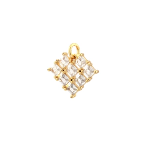 Macro shot of gold-plated hollow heart pendant with square-cut cubic zirconia inlays