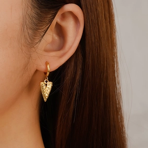 Fashion 18K gold plated stainless steel hoop earrings with hammered heart charm on model