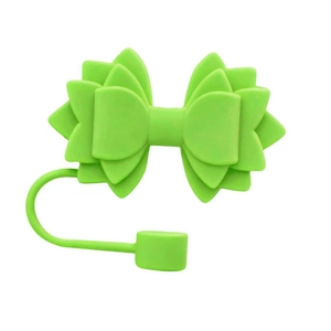 Close-up of a green silicone bow straw topper for Stanley cup decoration