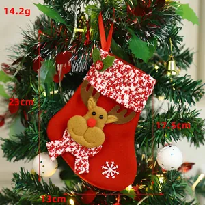 Christmas stocking with 3D reindeer and snowflakes hanging on a decorated tree