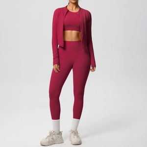 Three-piece berry red yoga set including jacket, sports bra, and high-waist leggings