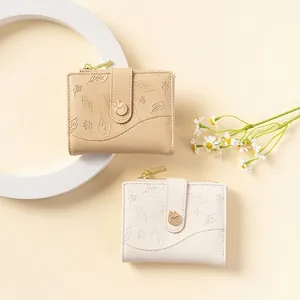 Short bi-fold women's wallet with leaf pattern embossing and gold zipper in khaki and beige