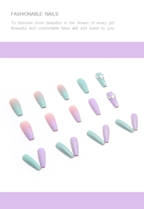 Detail of multi-style false nail set with pink-green gradients and rhinestone accents