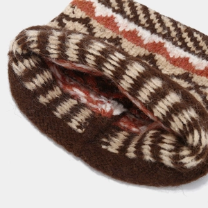Detailed close-up of ethnic Fair Isle wave pattern on thick knitted winter beanie hat