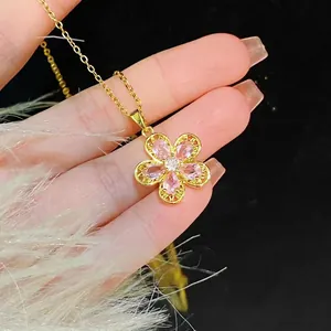 Sparkling pink floral pendant necklace with gold chain and zircon crystal petals