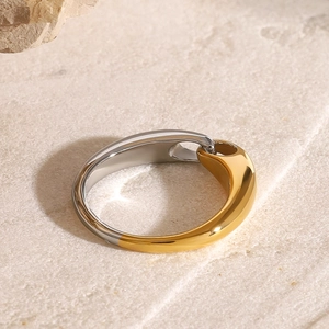 Minimalist two-tone stainless steel ring featuring a gold and silver mirror finish