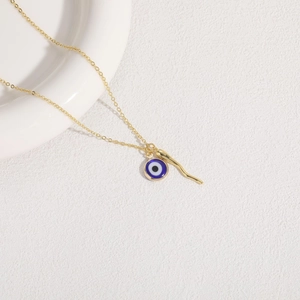 14K gold plated necklace with blue evil eye and golden cornetto horn charm pendants
