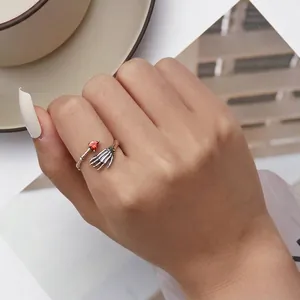 Gothic 925 silver skeleton hand ring with red heart stone in a vintage open design
