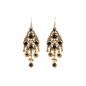 Vintage gold hollow earrings with black crystals and flower charms on white background