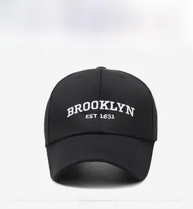 Front detail showing white Brooklyn Est 1631 embroidery on black cotton baseball cap