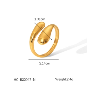 Detailed view of golden teardrop open ring with 1.31cm width and 2.14cm diameter