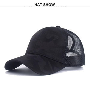 Close-up of black mesh ponytail baseball cap with camo print and breathable mesh design