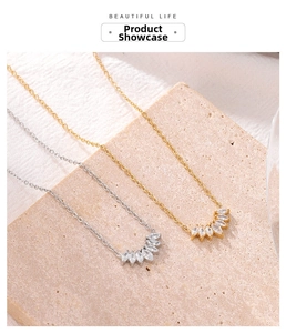 Detailed view of marquise zircon fan pendant necklaces in gold and silver finishes