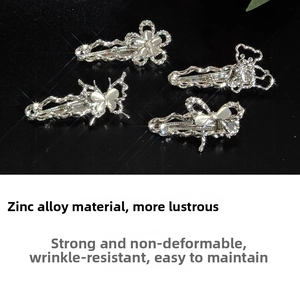 Detail of zinc alloy hair clips with opal cat eye stones and butterfly flower shapes