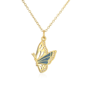 Close-up of butterfly pendant with blue enamel and sparkling zircon on a gold chain