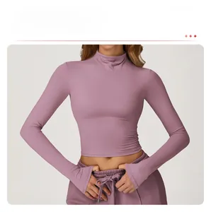 Detail view of high-neck lilac yoga top showing slim fit and breathable athletic fabric